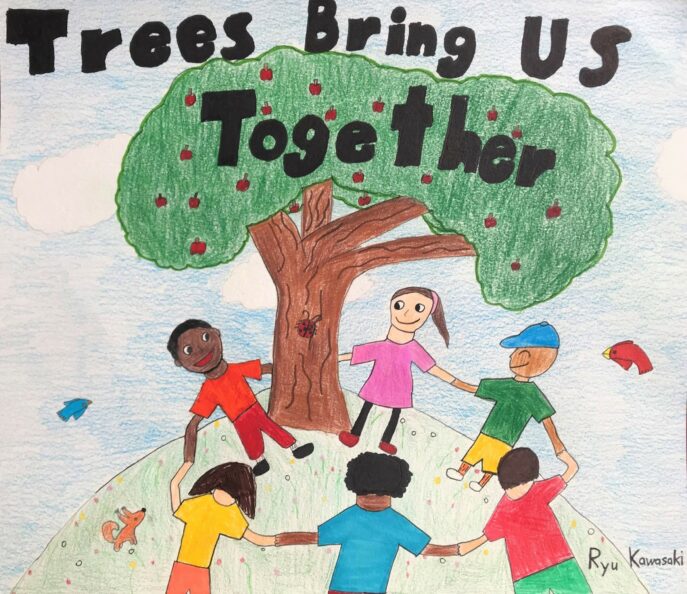 Children smiling and holding hands dancing around a tree