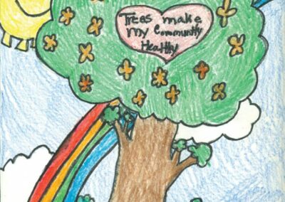 Large Tree with rainbows, a smiling sun and little houses below the tree with words that read Trees Make my community healthy